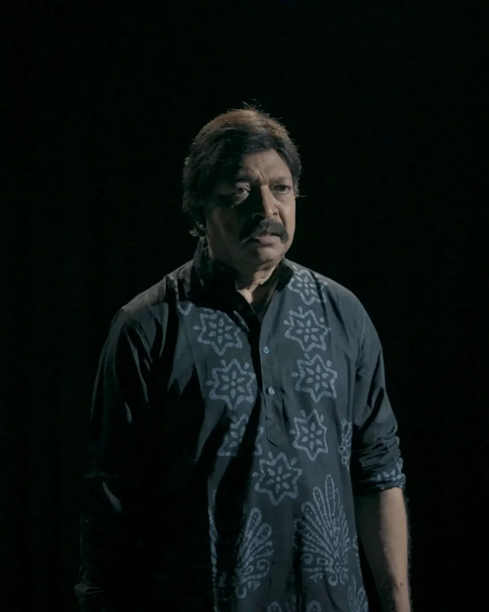 Yash Kirti on a dark stage