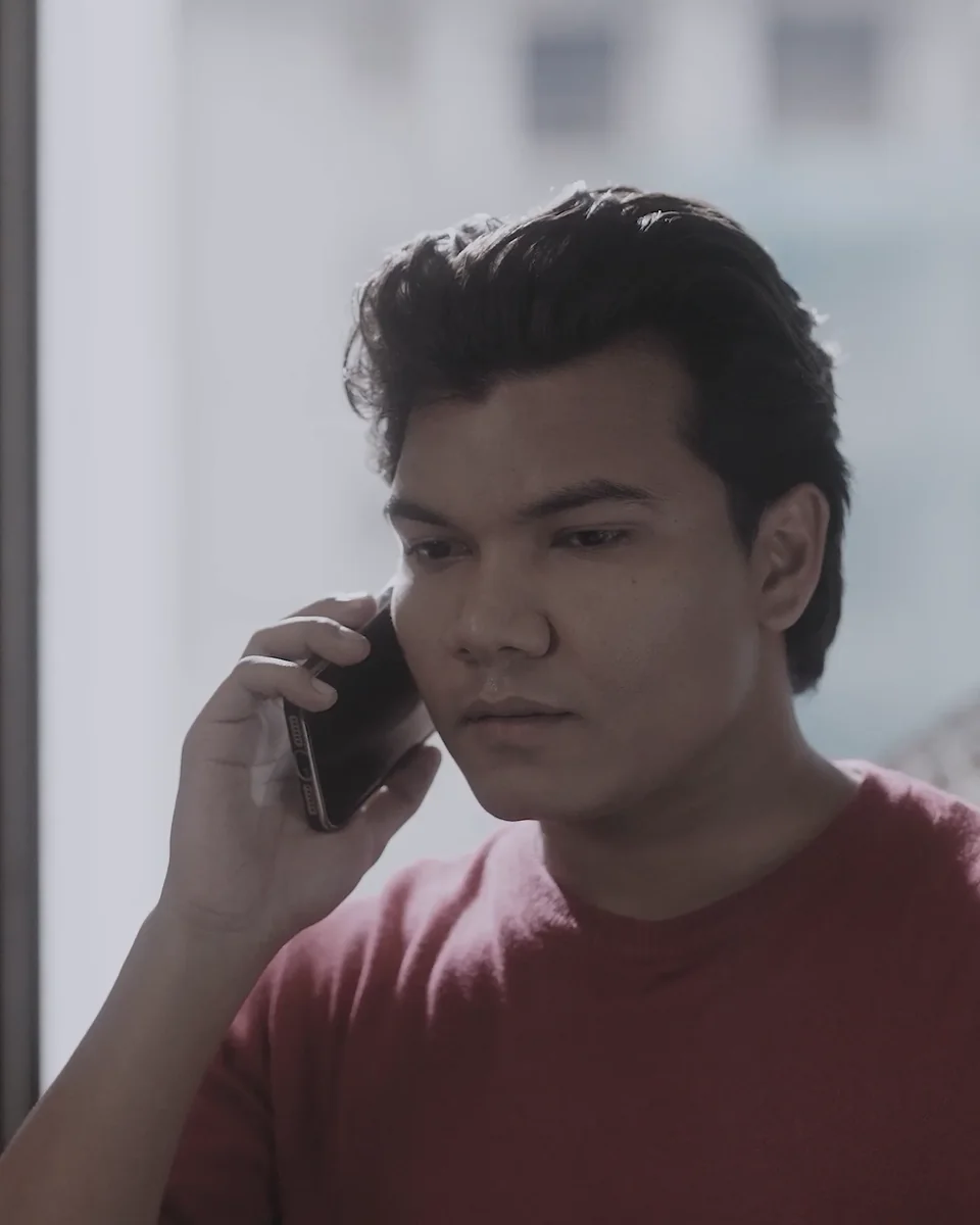 Iswar Mohan on a phone call