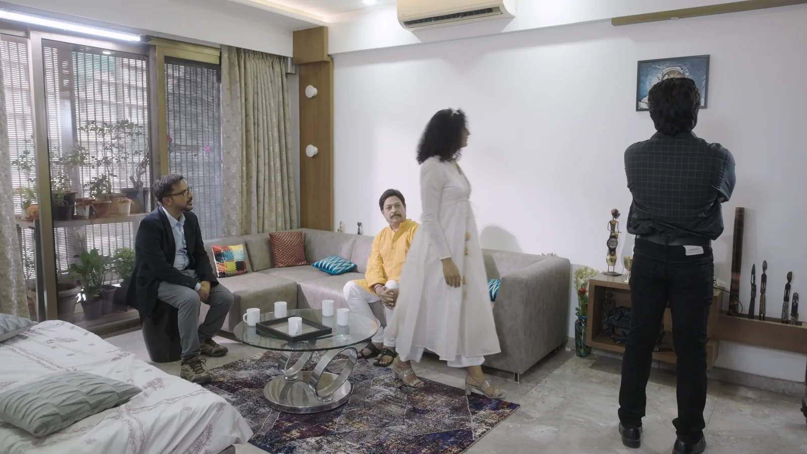 The four strangers in an apartment living room